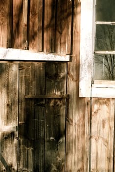 A fading falu red wall on a outhouse