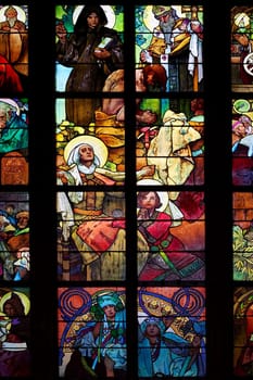 Detail of the color window - "Celebration of the Apostles""..Design: Alfond Mucha (1930)..St Vitus cathedral, Prague, Czech republic, Europe."