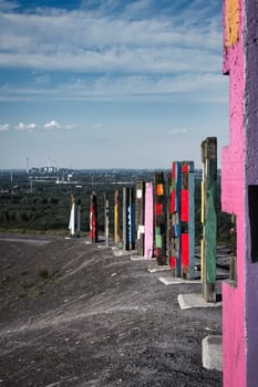 Vertical shot of an art installation made of colored piles in the Ruhr area in Germany
