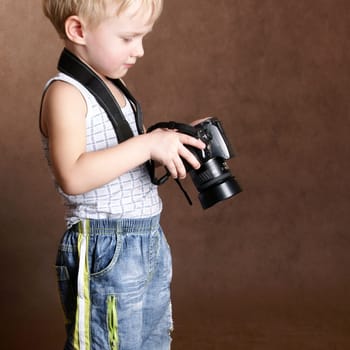 child in studio with professional camera