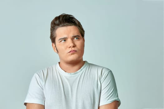 surprised man on a gray background. High quality photo