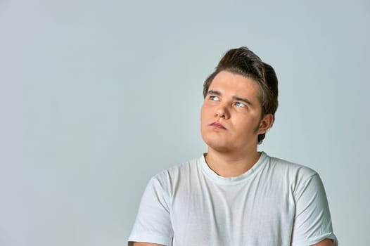 surprised man on a gray background. High quality photo