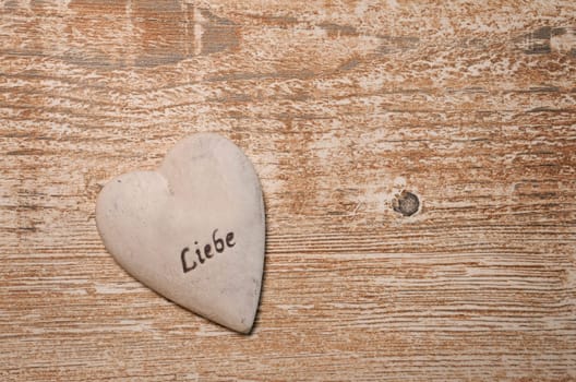 Heart on a rustic wooden background