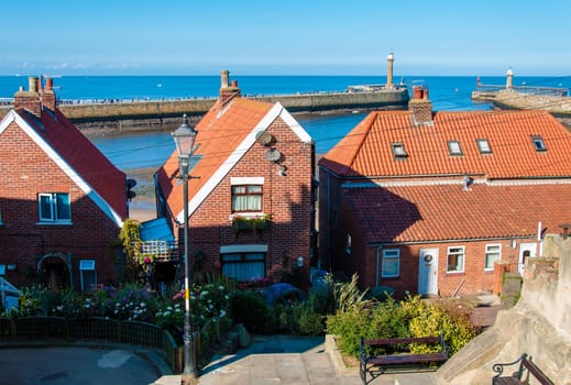 Scenic view of Whitby city in autumn sunny day.Whitby's attraction as a tourist destination is enhanced by its association with the world famous horror novel Dracula, written by Bram Stoker