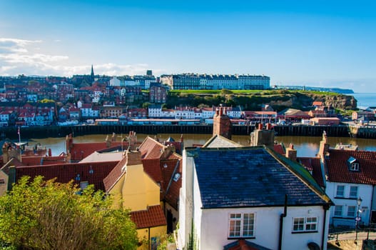 Scenic view of Whitby city in autumn sunny day.Whitby's attraction as a tourist destination is enhanced by its association with the world famous horror novel Dracula, written by Bram Stoker