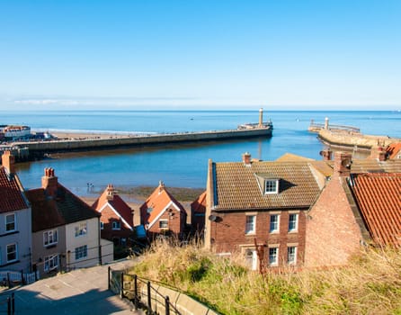 Scenic view of Whitby city in autumn sunny day.Whitby's attraction as a tourist destination is enhanced by its association with the world famous horror novel Dracula, written by Bram Stoker