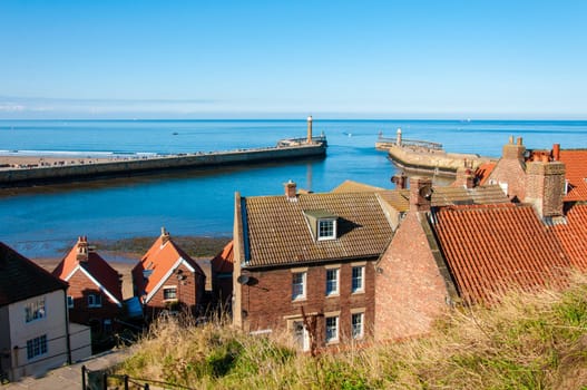 Scenic view of Whitby city in autumn sunny day.Whitby's attraction as a tourist destination is enhanced by its association with the world famous horror novel Dracula, written by Bram Stoker