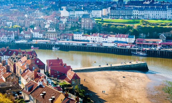Scenic view of Whitby city in autumn sunny day.Whitby's attraction as a tourist destination is enhanced by its association with the world famous horror novel Dracula, written by Bram Stoker