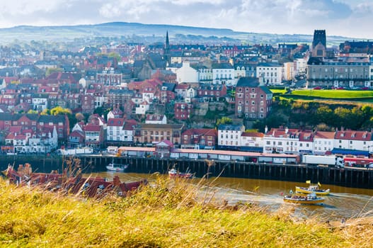 Scenic view of Whitby city in autumn sunny day.Whitby's attraction as a tourist destination is enhanced by its association with the world famous horror novel Dracula, written by Bram Stoker