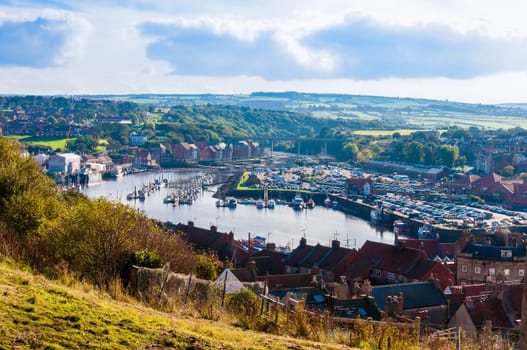 Scenic view of Whitby city in autumn sunny day.Whitby's attraction as a tourist destination is enhanced by its association with the world famous horror novel Dracula, written by Bram Stoker