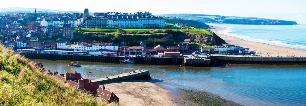 Scenic view of Whitby city in autumn sunny day.Whitby's attraction as a tourist destination is enhanced by its association with the world famous horror novel Dracula, written by Bram Stoker