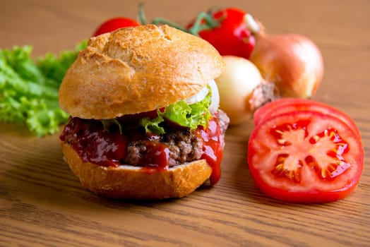 home made hamburger with meat, onion and tomato