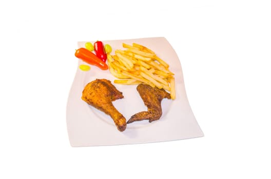 Close-up of a plate of brown fried grilled chicken and fries against a white background.