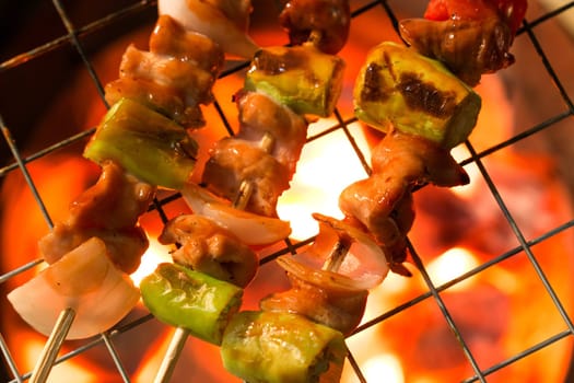 Grilling shashlik on barbecue grill