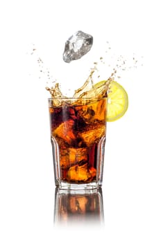 Long drink with ice cubes and splashes