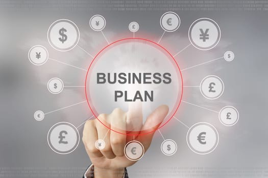 hand pushing business plan button with global networking concept