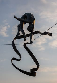 Cracow, Poland - May 2, 2022: Balancing sculptures between sky and water by Jerzy Kedziora over the Kornatka footbridge over the Vistula River in Krakow