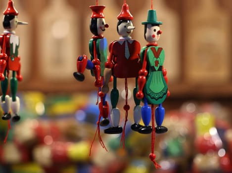 Cracow, Poland - December 19, 2021:Traditional wooden Pinocchio toy sold in souvenir shop in Cracow.