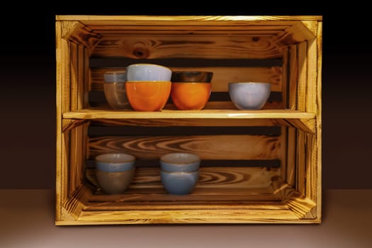 Several ceramic bowls stand very decoratively in a wooden box.
