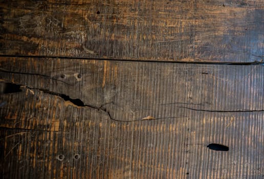 Wooden boards lying next to each other. A wood texture made of several wooden boards.
