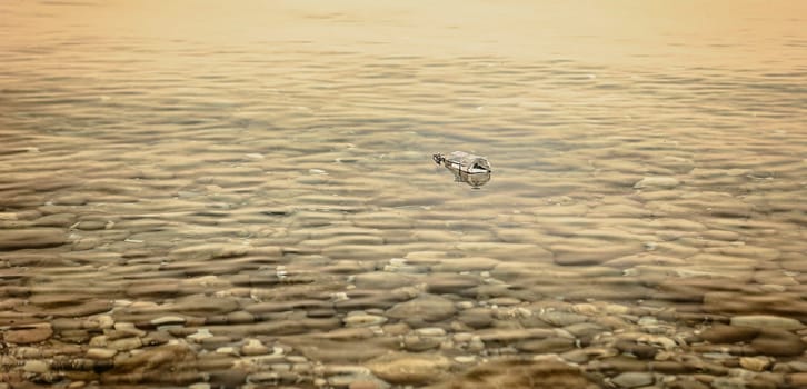 A Message in a Bottle at Sunset