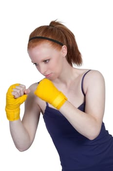 A beautiful young woman wearing a pair of boxing gloves