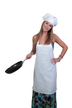 A beautiful young woman chef holding a  frying pan