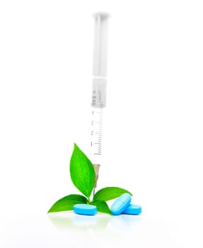 Concept of alternative medicine with a plant and pills