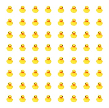 Yellow toy ducks in row background against white