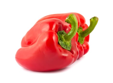 two fresh red peppers isolated on white background