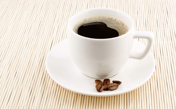 Coffee cup with beans isolated on white background