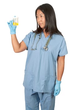 A beautiful young Asian woman doctor in scrubs holding a urine sample