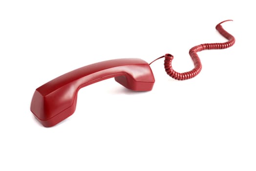 Unhooking red telephone receiver with cable on white background