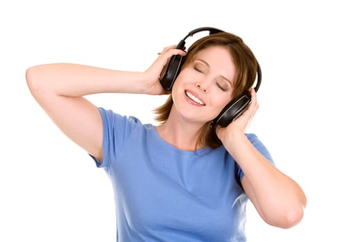 pretty casual brunette is listening to music on white background