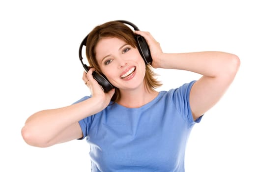 pretty casual brunette is listening to music on white background