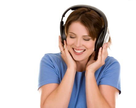 pretty casual brunette is listening to music on white background