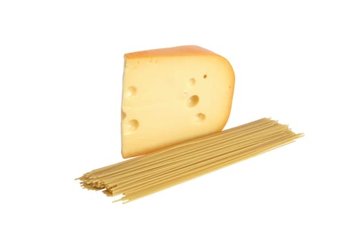 Big piece of cheese near raw spaghetti on white background. Isolated with clipping path