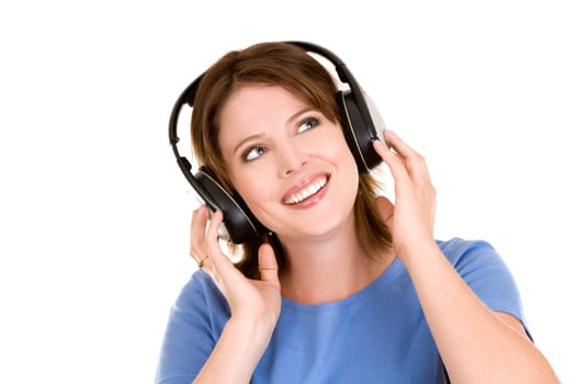 pretty casual brunette is listening to music on white background