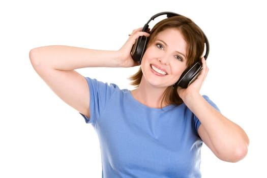 pretty casual brunette is listening to music on white background
