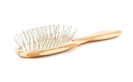Single bamboo hair brush isolated on a white background. .