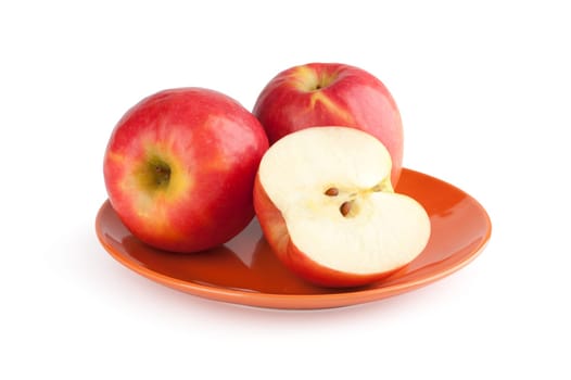 Ripe red apples on a white background