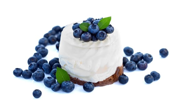 Cheesecake with blueberries on white background