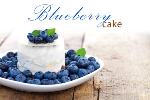 Cheesecake with fresh blueberries on wooden table, rustic style, place for your text up