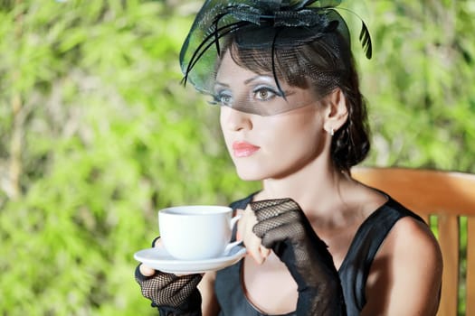 Fashion woman retro portrait in a restaurant