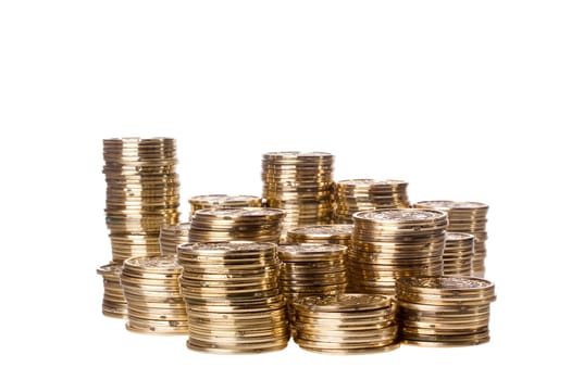Stacks of golden coins isolated on a white background.