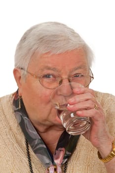 Senior woman drinking water isolated on white background