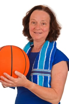 Middle aged woman with basketball on white background