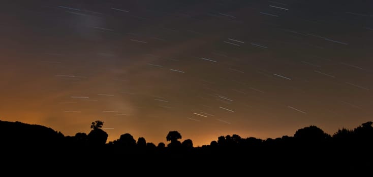 Long exposure photo of night sky with stars trail