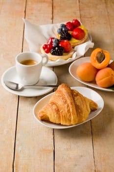 photo of delicious tasty breakfast food on wooden table