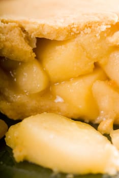 fresh homemade apple pie over green glass dish macro colseup